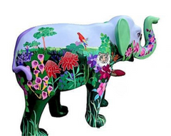 Large hand-painted resin elephant sculpture titled "Rainforest Majesty," featuring vibrant rainforest-themed artwork with tropical plants, a parrot, and a tiger on a lilac and green background; made to order and inspired by a charity design supporting Havens Hospices