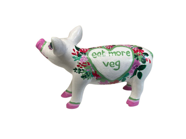 Hand-painted resin mini pig figurine with “Eat More Veg” message inside a heart, decorated with pink, red, and green floral accents on a white base.