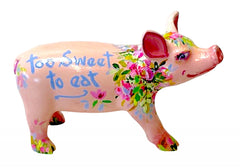 Hand-painted pink resin mini pig with floral design and blue “Too Sweet to Eat” message – whimsical collectible from the Painted Pigs collection.