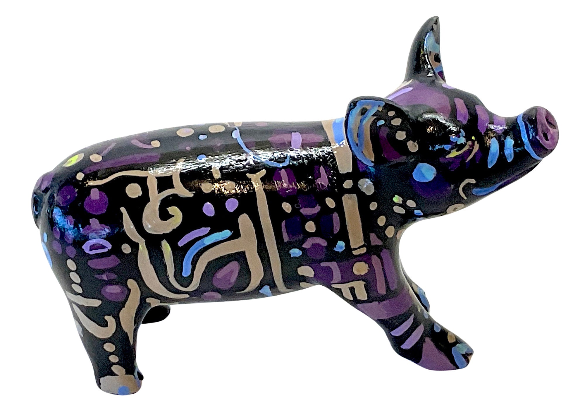 Hand-painted resin mini pig figurine with tribal-inspired abstract patterns in gold, electric blue, and lavender on a glossy black base.