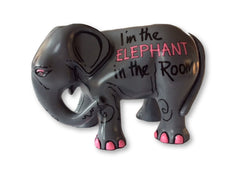 Hand-painted charcoal grey resin elephant figurine with the phrase 'I'm the ELEPHANT in the Room' in pink and black lettering, featuring pink toenails and whimsical detailing