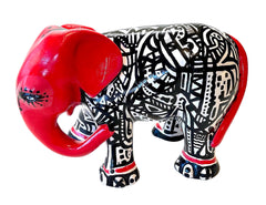 Hand-painted resin elephant figurine with red head and tail, and bold black-and-white tribal patterns; a striking, collectible piece of modern décor.