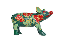 Hand-painted green miniature pig figurine with bold red flowers, gold outlines, and leafy accents—collectible resin art from the Painted Pigs collection.