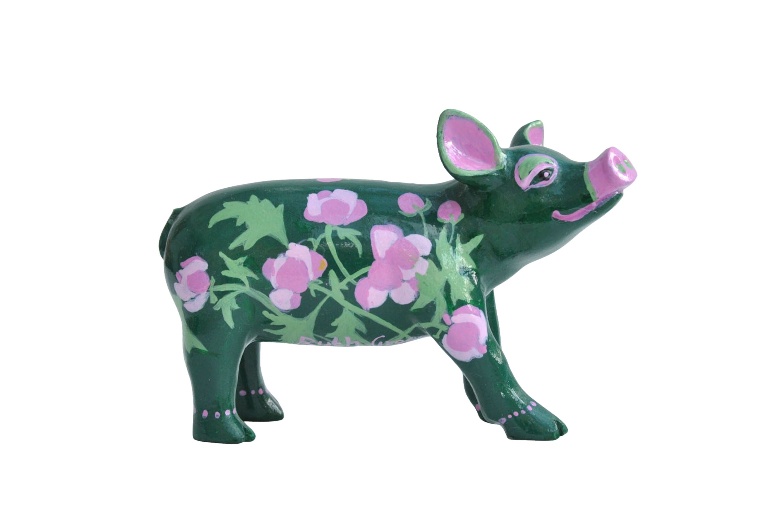 Hand-painted green miniature pig figurine with pink floral patterns and leafy detailing—resin collectible from the Painted Pigs collection.