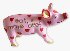 Hand-painted "Eat More Beef" mini pig figurine with a pink body, red heart pattern, and glittery gold lettering—resin collectible from the Painted Pigs collection.
