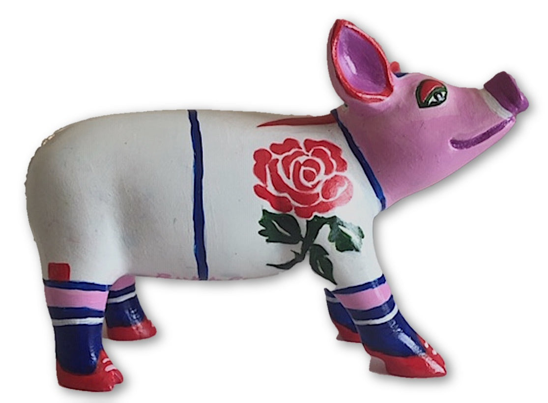 Hand-painted England Rugby Mini Pig collectible featuring a red rose emblem, white jersey body, pink head, and navy-red detailing on hooves and ears.