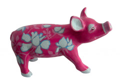 Hand-painted resin mini pig figurine with a bright fuchsia base, decorated with soft blue floral patterns and pastel blue accents on ears, hooves, and snout.