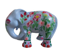 Hand-painted blue resin elephant figurine decorated with pink and red floral patterns and green leafy details, from the Painted Pigs collection