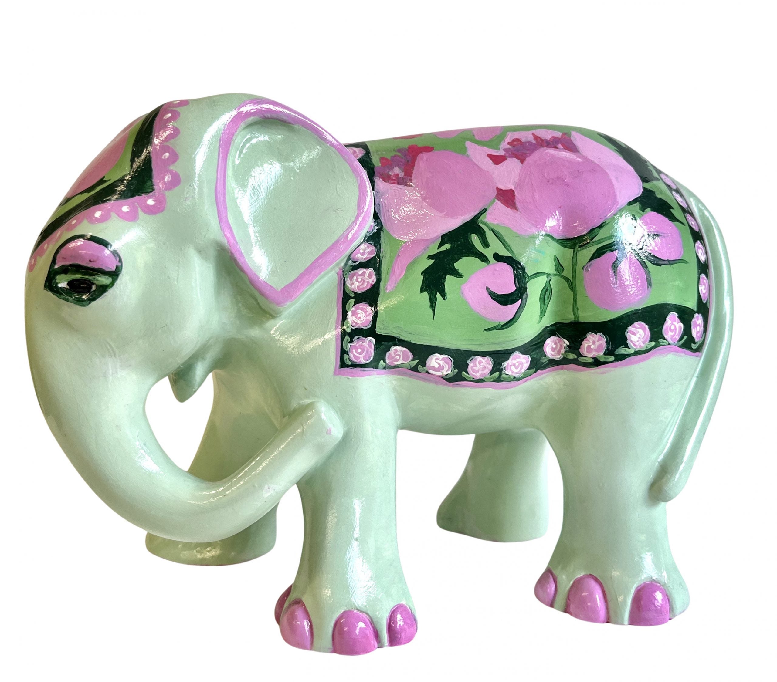 Hand-painted pastel resin elephant figurine with mint green base, pink floral blanket design, and delicate detailing; signed and collectible artwork piece.
