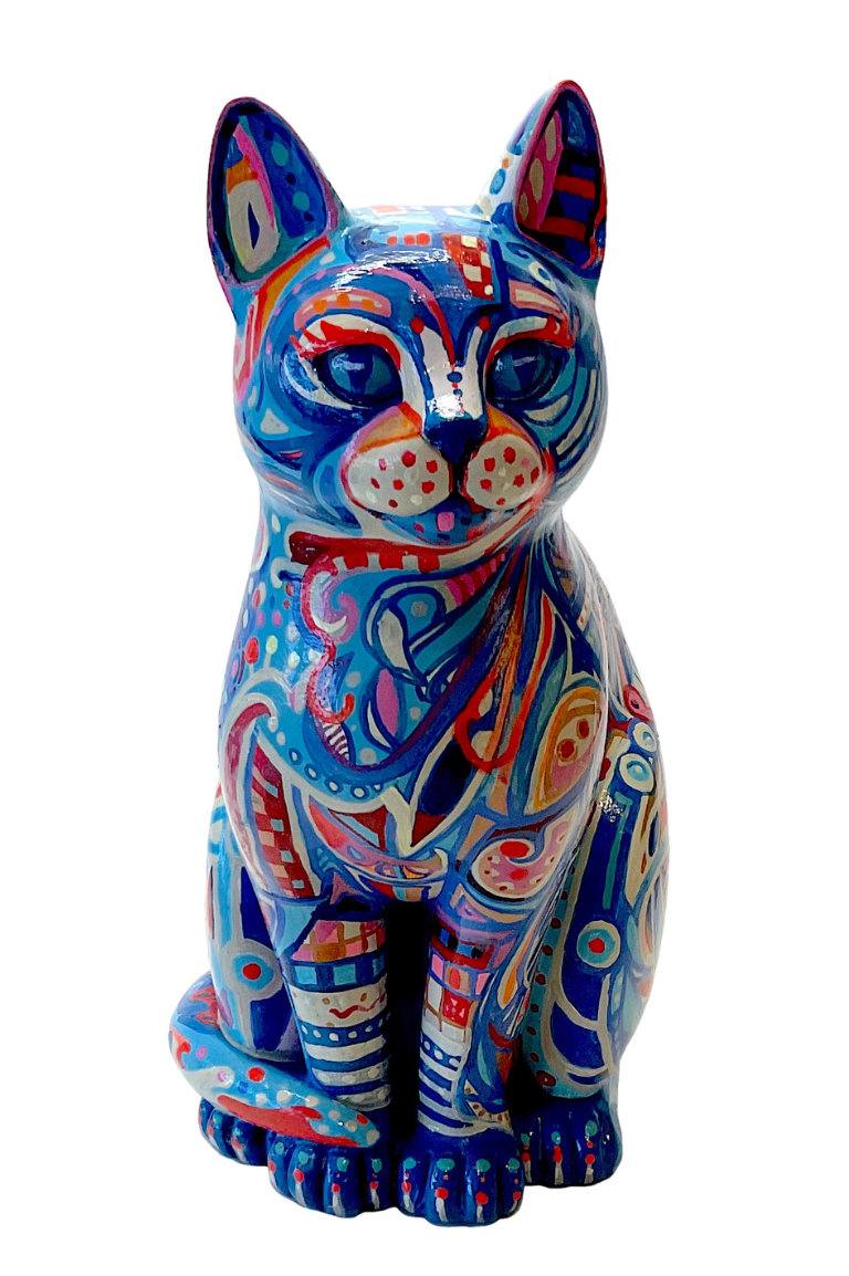 Hand-painted resin cat ornament with bold abstract patterns in blue, red, and gold, featuring swirls, dots, and geometric shapes on a seated figure.