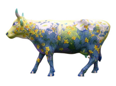 Life-size resin cow sculpture hand-painted with vibrant daffodils and garden scenery; made to order and weather-resistant for outdoor display.