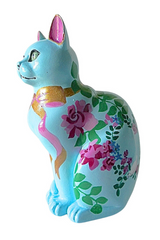 Hand-painted sky-blue resin cat ornament with pink and purple floral designs, green foliage, and a gold and pink ribbon around the neck